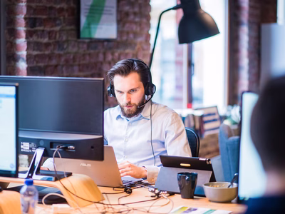 A member of an IT team solving an issue.