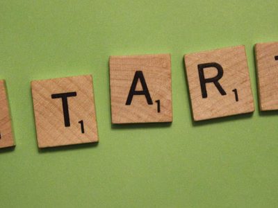 Scrabble letters spelling 'START'.