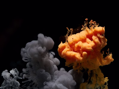 Plumes of grey and orange smoke.