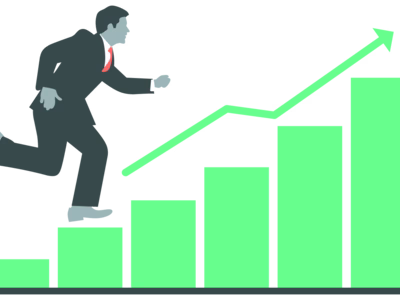 A man running up a bar chart which is growing - connoting business growth.