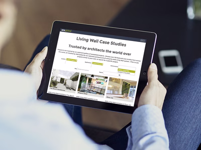 ANS Global: Company Website Living Wall Case Studies page on an Apple iPad.