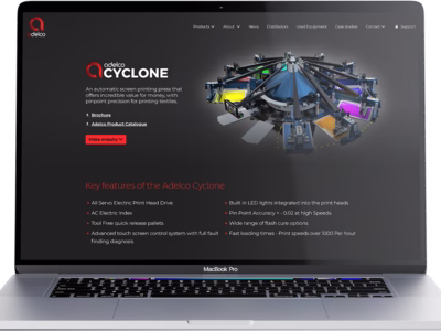 The Adelco website shown on a MacBook Pro.