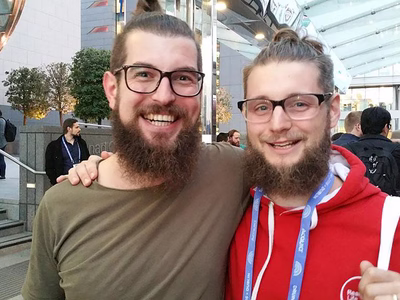 Bart Feenstra and Darren Fisher in Dublin - two young men with long hair in top knots thick rimmed glasses and long beards.