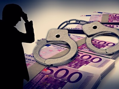 Bundles of Euro bank notes overlaid by handcuffs and a sinister sillouetted character on the left.