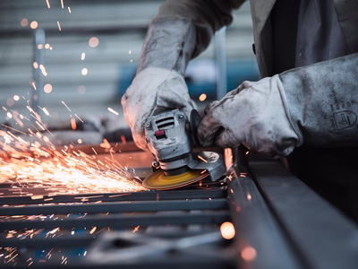 Worker using an angle grinder