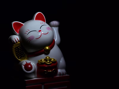 Porcelain Chinese lucky waving cat.