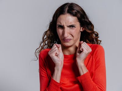 A lady grimacing in disgust.