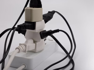 Extension lead overloaded with power sockets.