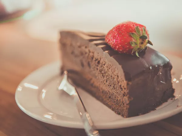 Chocolate cake with strawberry on top.