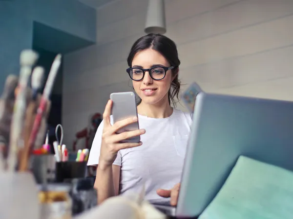 A marketing manager picking up the phone, ready to engage with Pivale's Drupal development services.