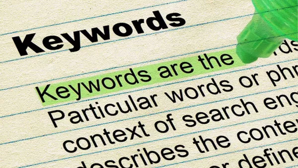 A piece of paper with the title Keywords and then some text underneath, an area of which is highlighted which reads: 'Keywords are the'.