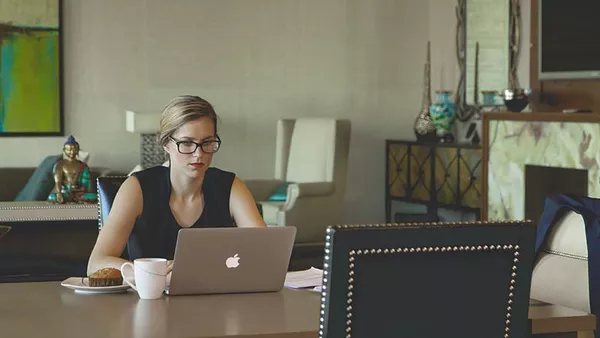 A lady on a laptop.