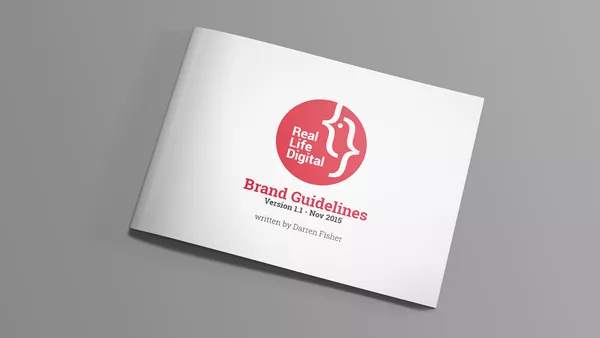 A closed copy of Real Life Digital's branding document showing the cover.
