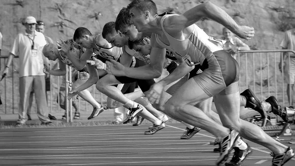 A group of sprinters racing as fast as they can.