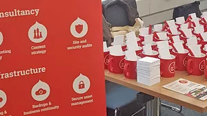 Real Life Digital merchandise stand at DrupalCamp London 2017.