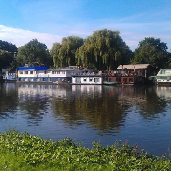 Houseboats on Thames river in Richmond - Surrey - UK.