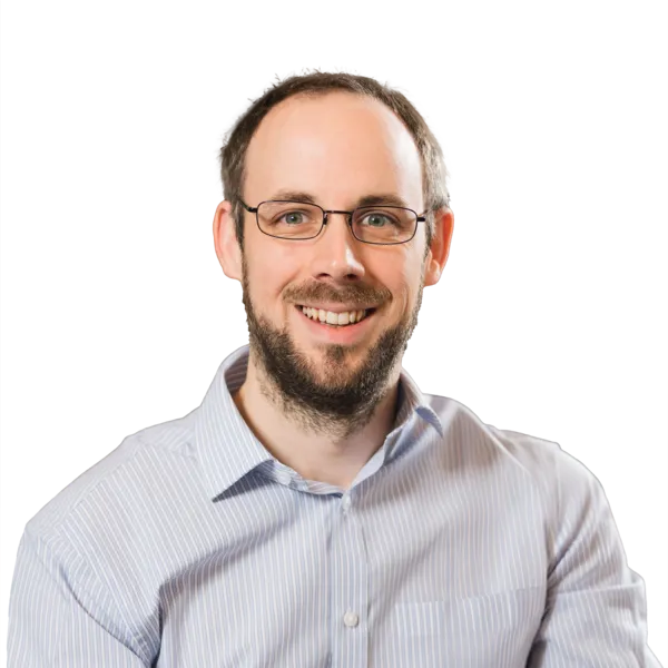 Barry Fisher, Founder and CEO at Pivale Drupal agency - a man with dark hair, a neat beard, moustache and glasses.