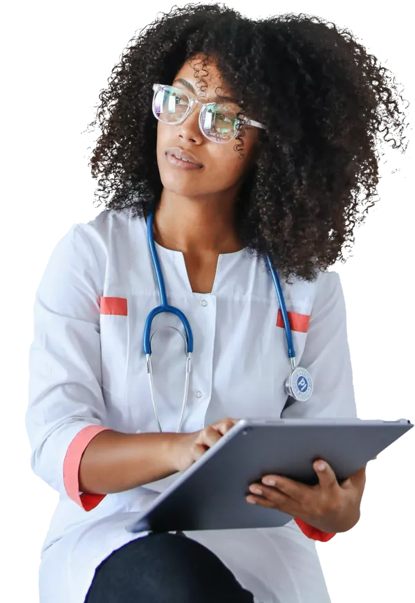 A female doctor making notes on an iPad.